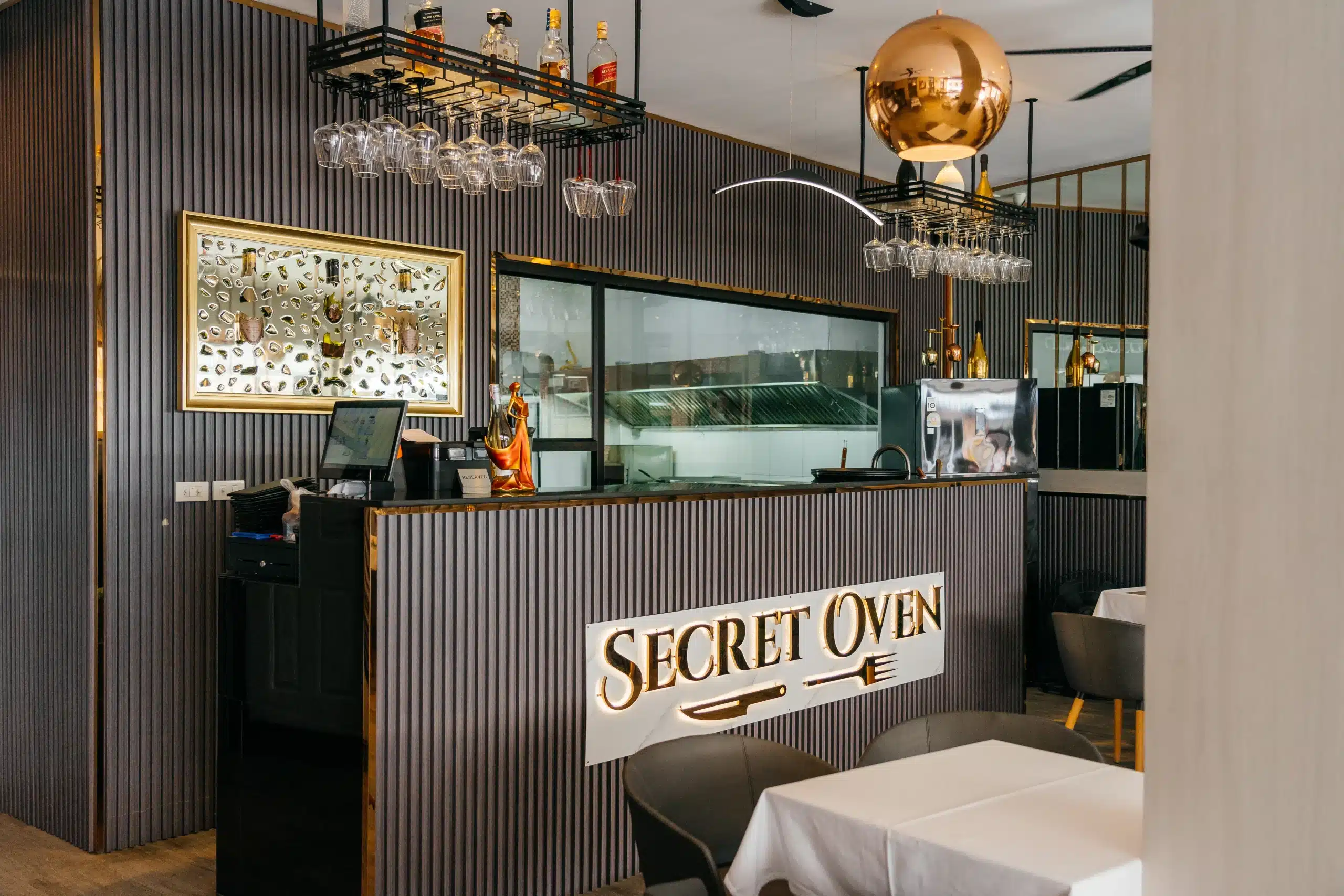 Secret Oven’s welcoming restaurant atmosphere with handcrafted decor and cozy tables