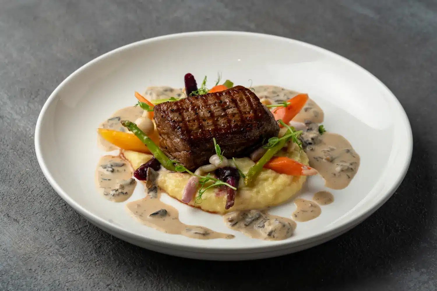 Tender and juicy Australian beef tenderloin steak plated with mashed potatoes at Secret Oven Koh Samui